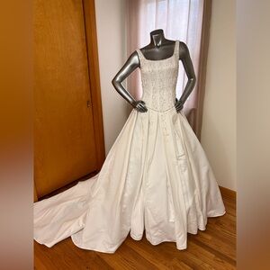 Elegant White Satin Ball Gown with Beaded Bodice.